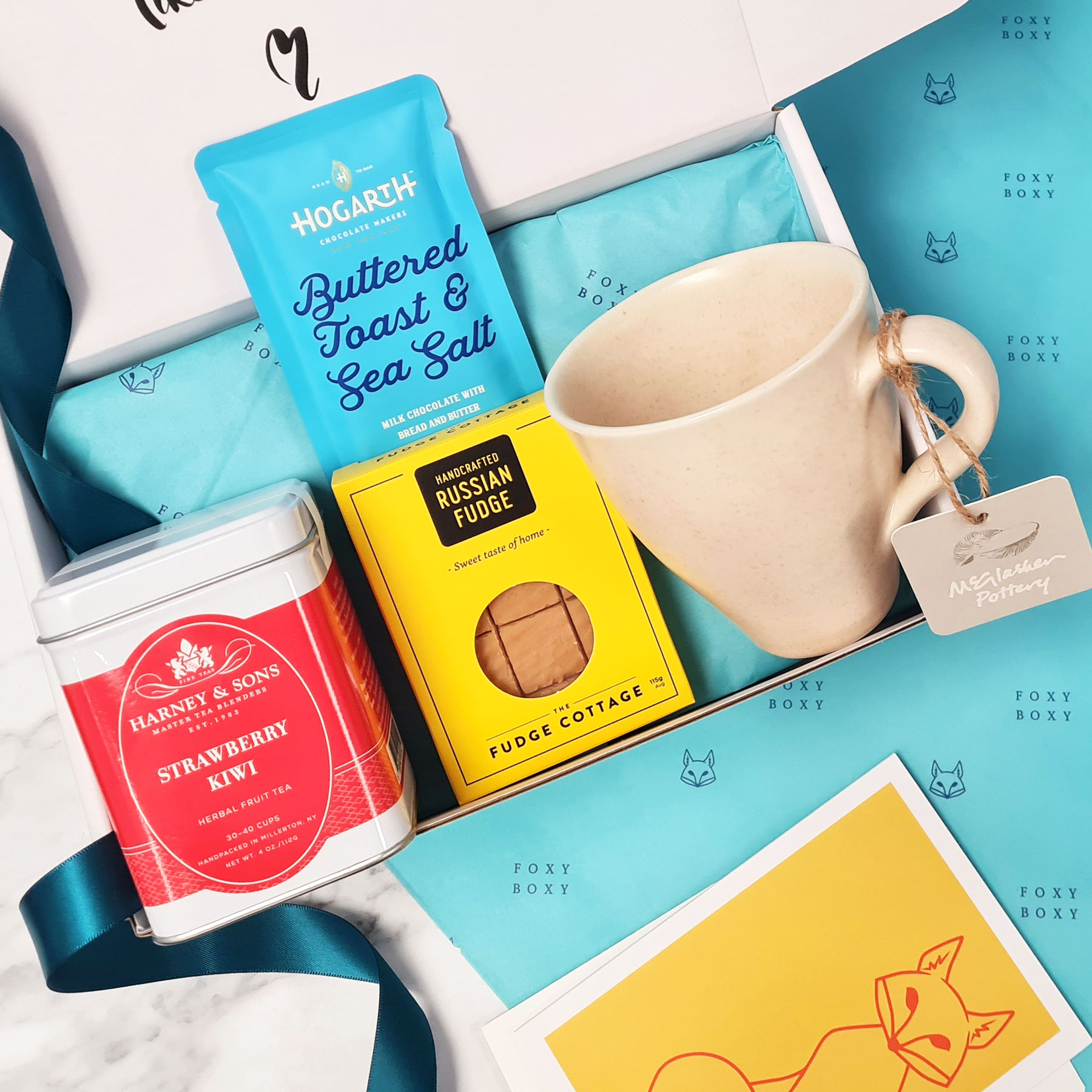 FOXY-BOXY-lovely-to-a-tea-gift-box-strawberry-kiwi-fruit-tea-nz-pottery-mug Lovely to a Tea gift box with NZ McGlashen pottery mug, Harney & Sons strawberry & kiwi fruit tea, NZ fudge and craft chocolate. FOXY BOXY gift boxes