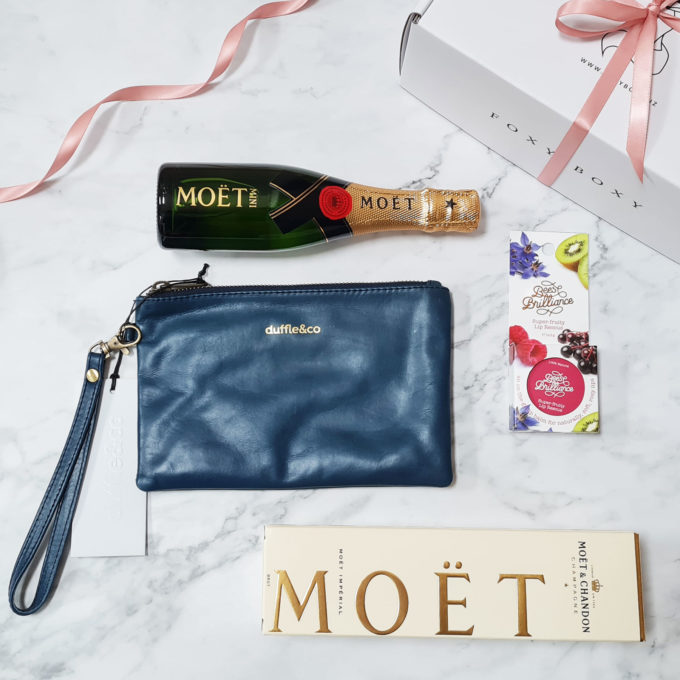 She Is Wonder gift box for her, featuring Navy Leather Clutch