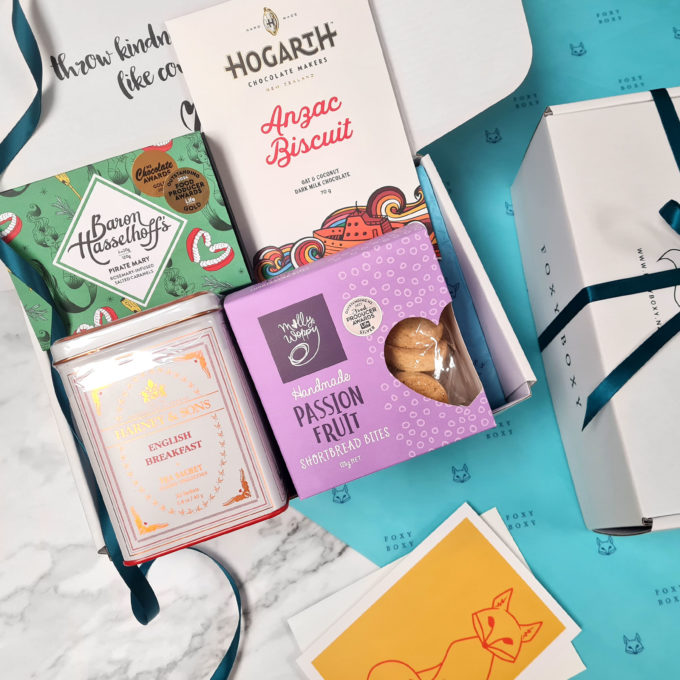 Tea, Cookies & Treats gift box by FOXY BOXY. Features Harney & Sons tin of english breakfast tea, award-winning chocolate, passionfruit shortbread cookies, award-winning salted caramels