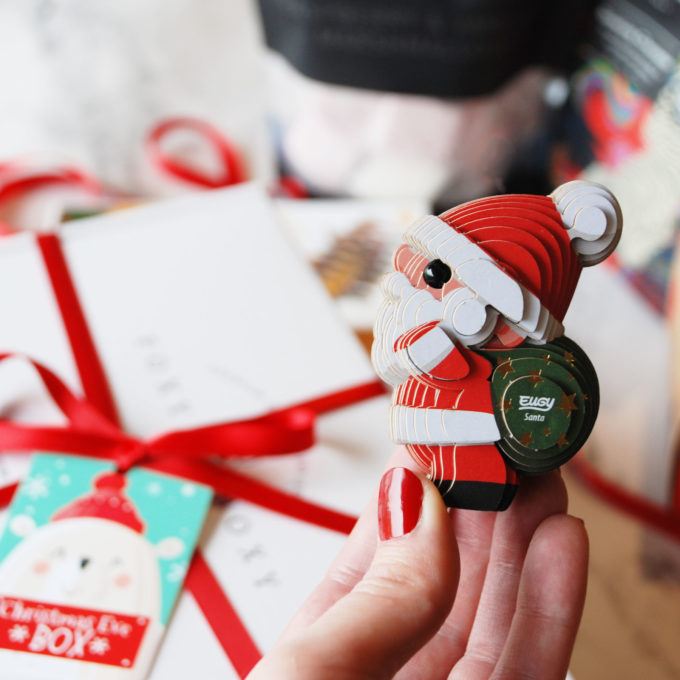 Hand holding Eugy Santa model, cute Christmas craft
