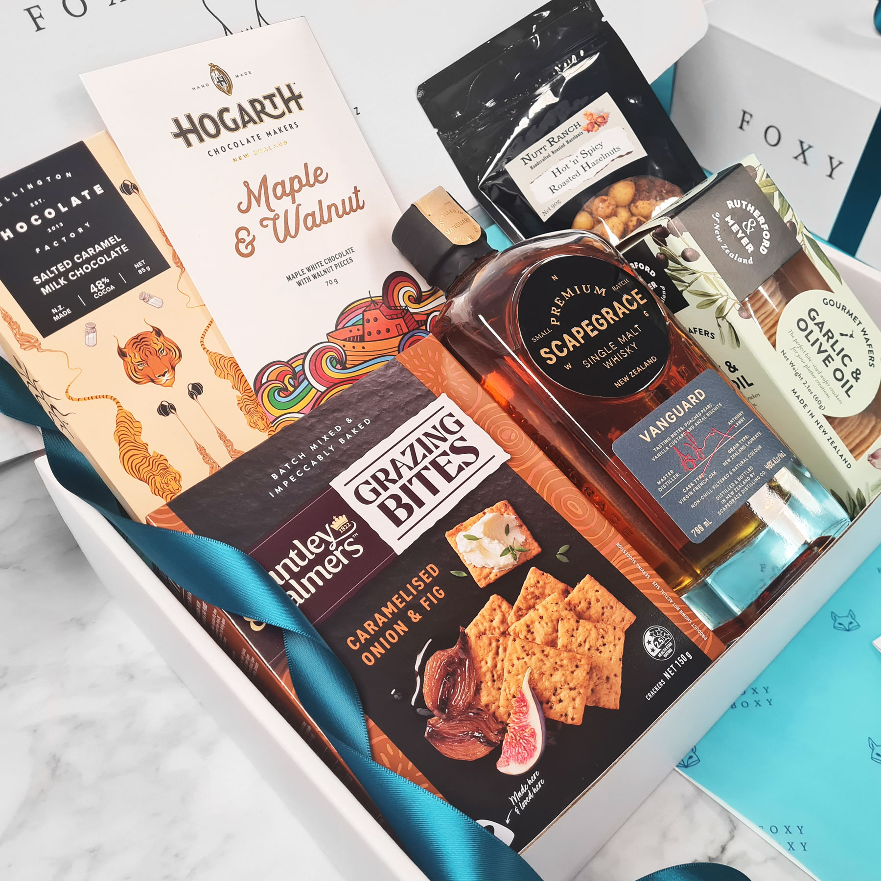 FOXY-BOXY-deluxe-whisky-and-treats-delivered-nz-wide-gift-hamper Deluxe Whisky & Treats gift box. Scapegrace Vanguard, award-winning New Zealand single malt whisky from Scapegrace Distillery.