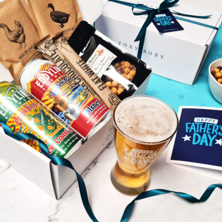 Happy Father's Day Gift Box By FOXY BOXY. Featuring 2 Beers From Eddyline Brewery, A "happy Father's Day" Beer Glass, Bean To Bar Chocolate From OCHO And Roasted Hot 'n Spicy Roasted Hazelnuts And 2 Seasonings From Wild Fennel