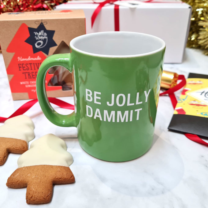 Christmas green mug with message: "Be jolly dammit"