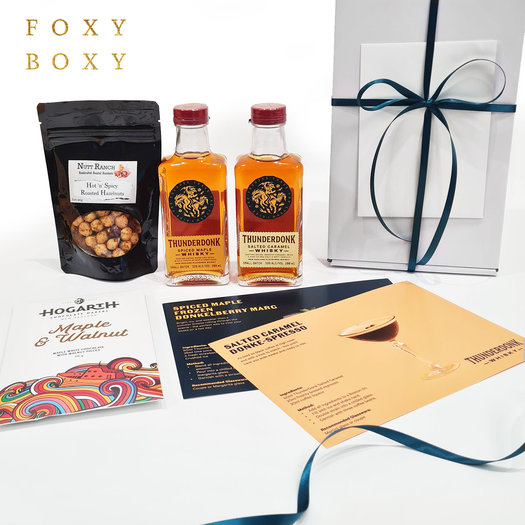 FOXY-BOXY-whisky-and-treats-gift-box-with-thunderdonk Whisky & Treats gift box by FOXY BOXY. 100% NZ made, 2 varieties of flavoured whisky, award-winning chocolate, hot 'n spicy roasted hazelnuts and 2 cocktail recipe cards