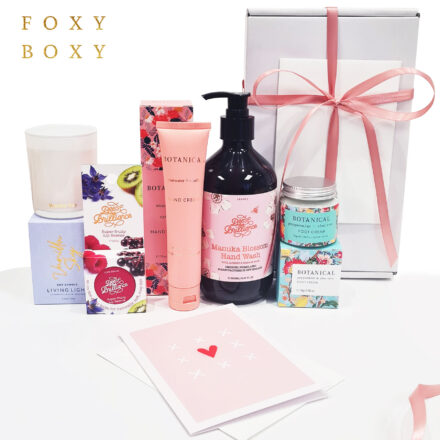 Pamper Her Gift Box By FOXY BOXY. Features Tinted Lip Balm, Vanilla Scented Soy Candle, Luxury Rosewater Hand Cream, Manuka Blossom Hand Wash And Peppermint Foot Cream.